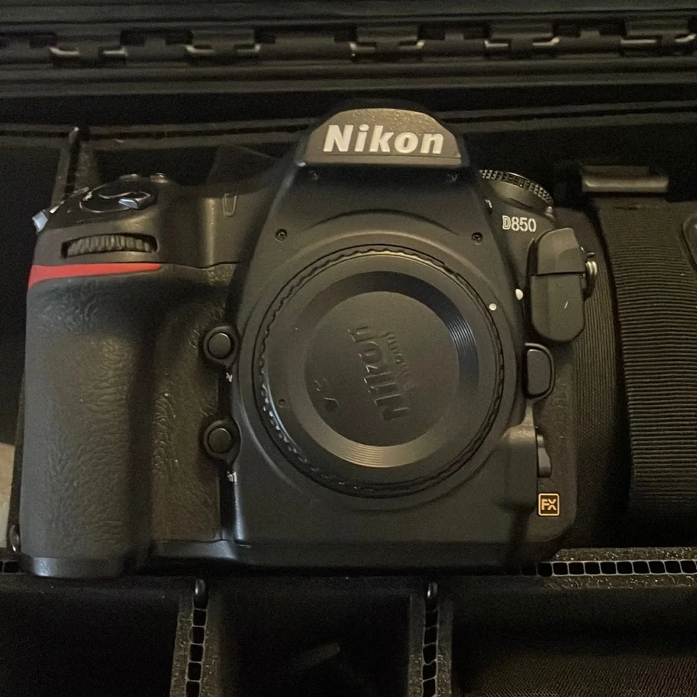Nikon D850 digital black camera. With battery charger